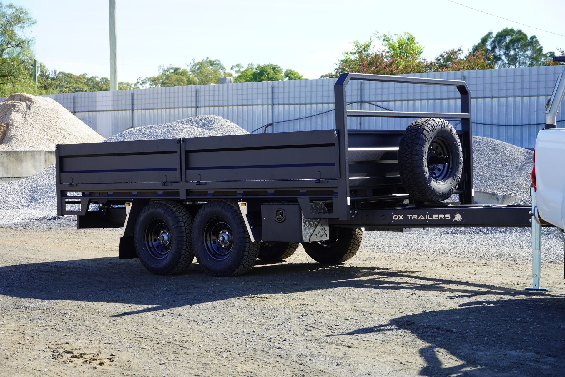 The King of Spades Excavation tipper trailer at a sand quarry, being towed behind a hilux.