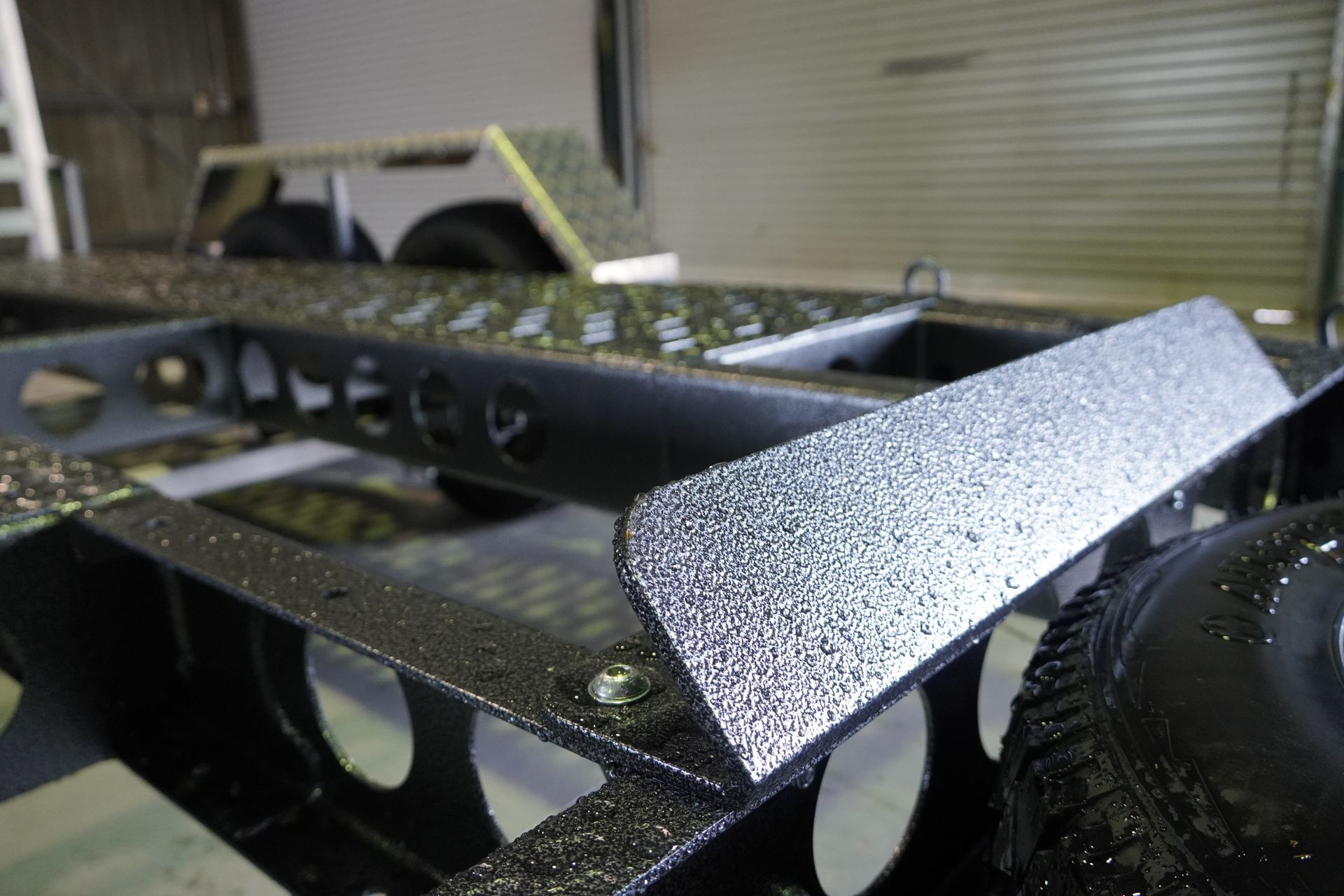 An attachment rest securely welded onto a plant trailer for easy equipment transport