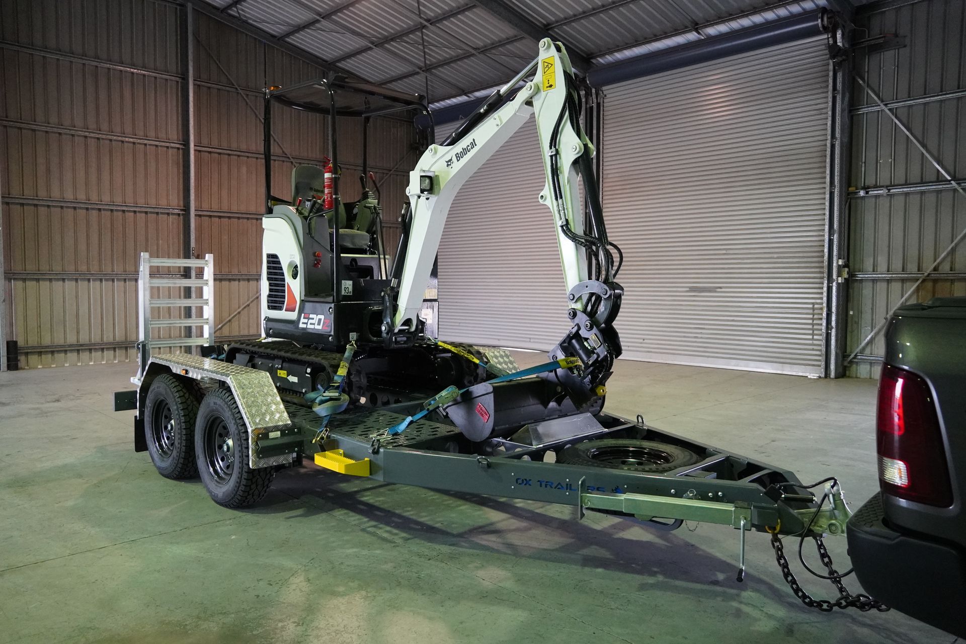 The trade series plant trailer carrying an excavator.