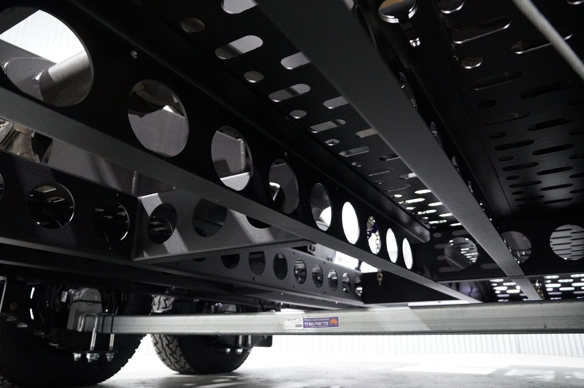 Heavy Duty Plant Trailer with tie down points. Featuring attachment storage for machinery.