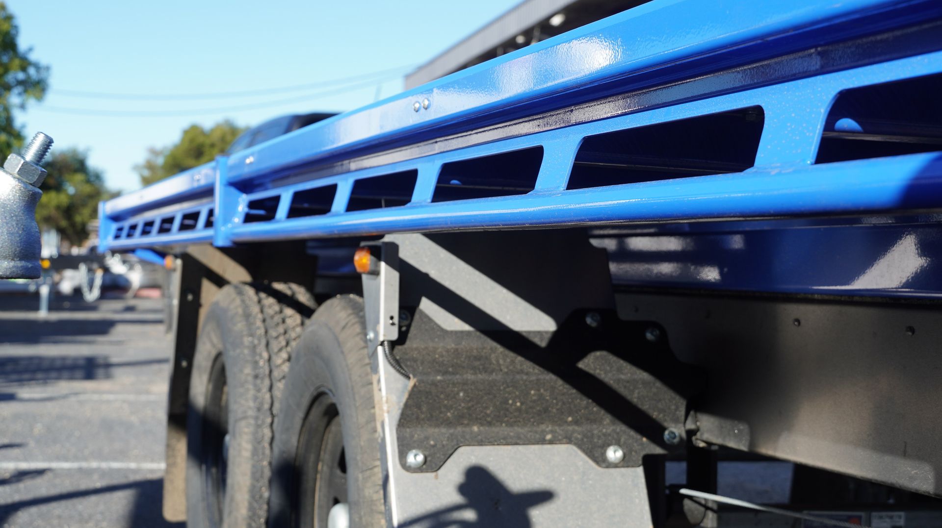 The rope rail of an ox trailer trade series flat top trailer.