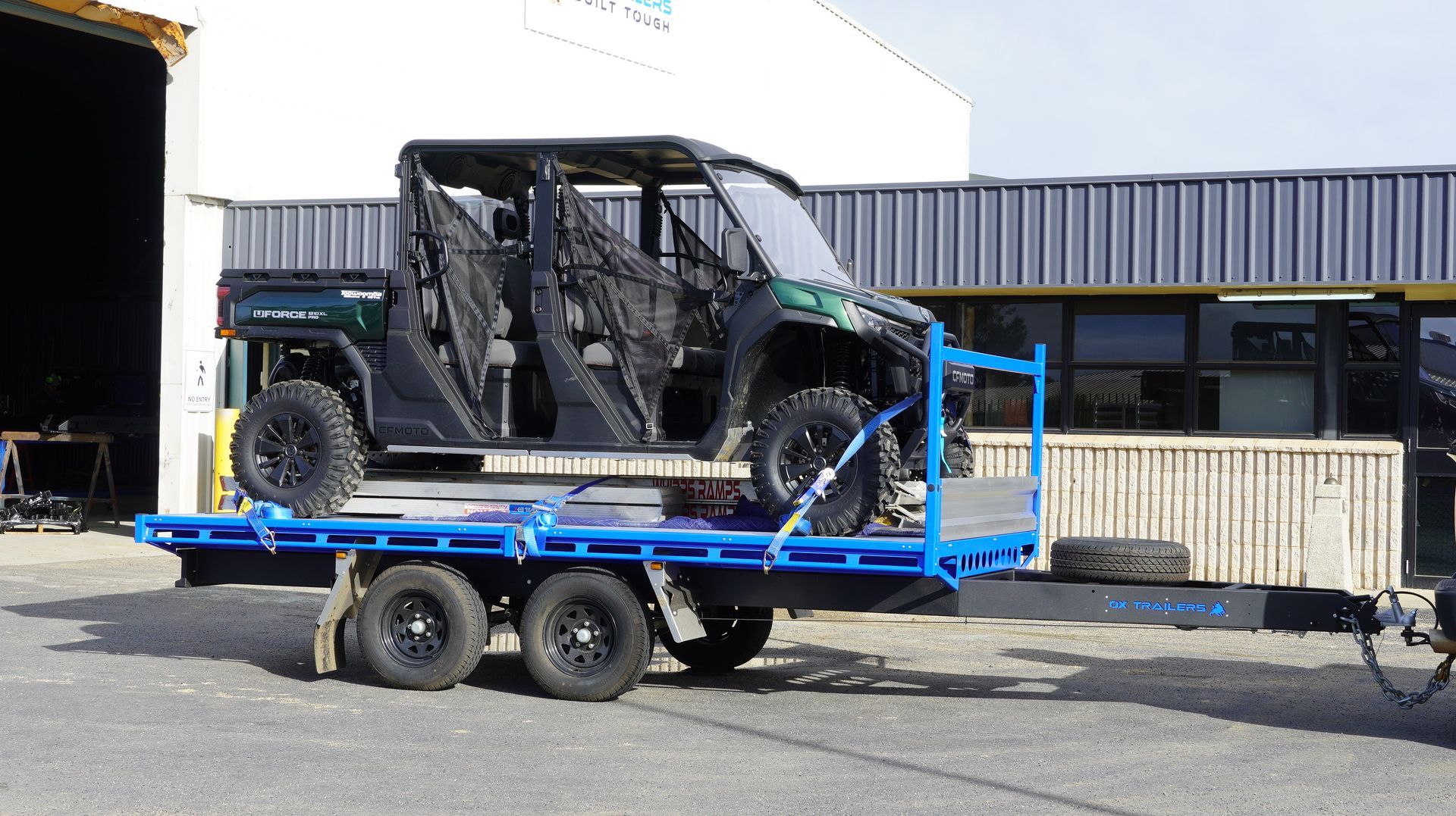 3.5t heavy duty trade series flat top trailer carrying off road vehicle at ox trailers head quarters