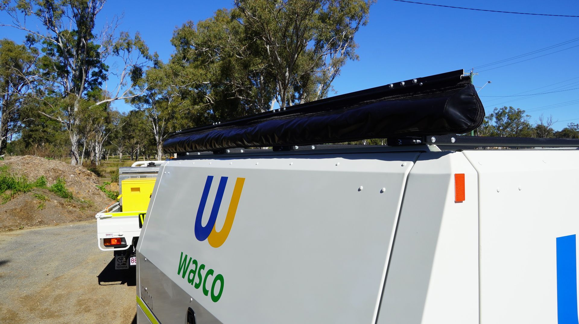 Custom full length awning of ox trailers service trailer for shade on mine sites