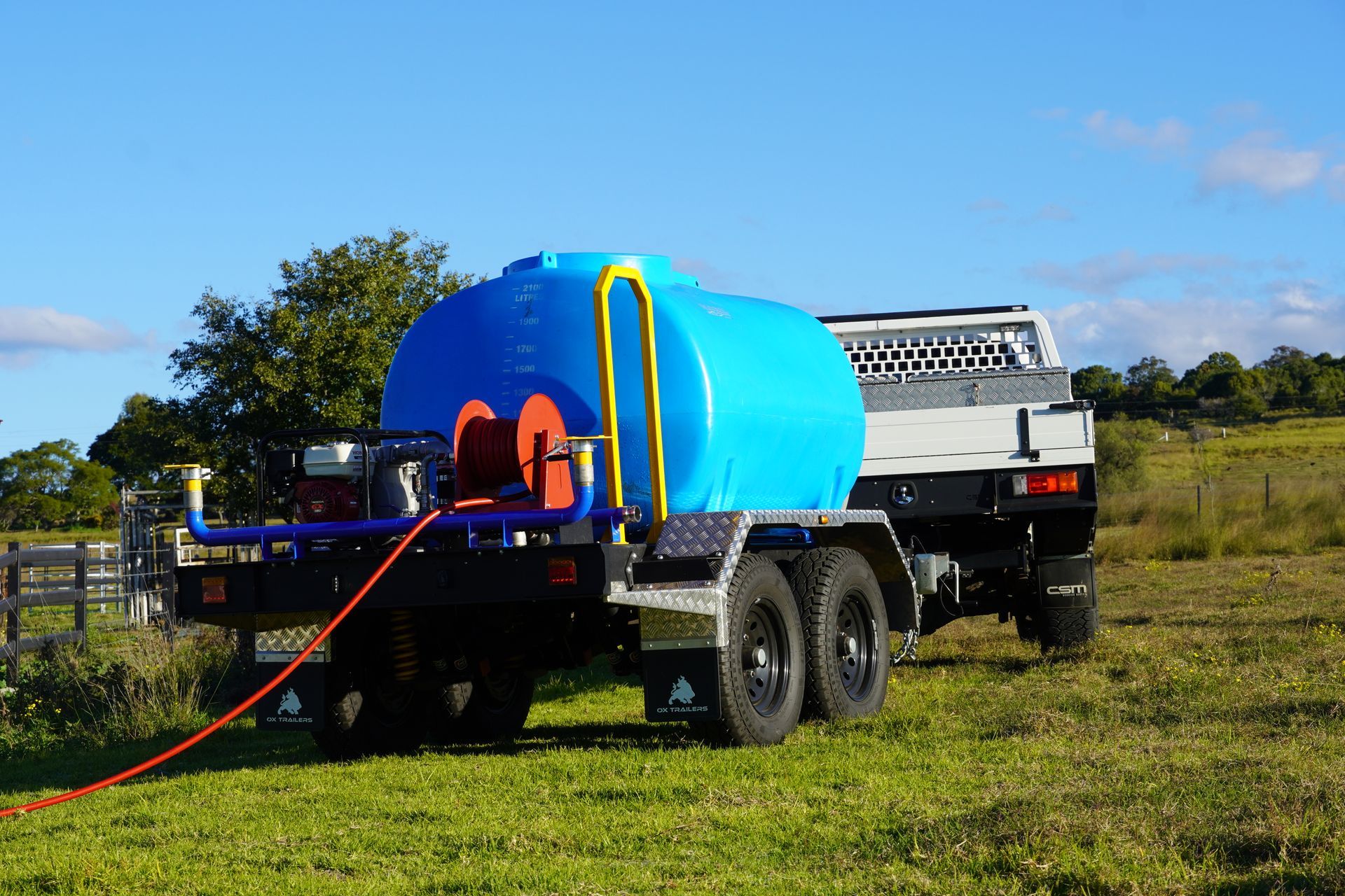 Heavy Duty Plant Trailer with tie down points. Featuring ratchet straps, hooks and tire of excavator.