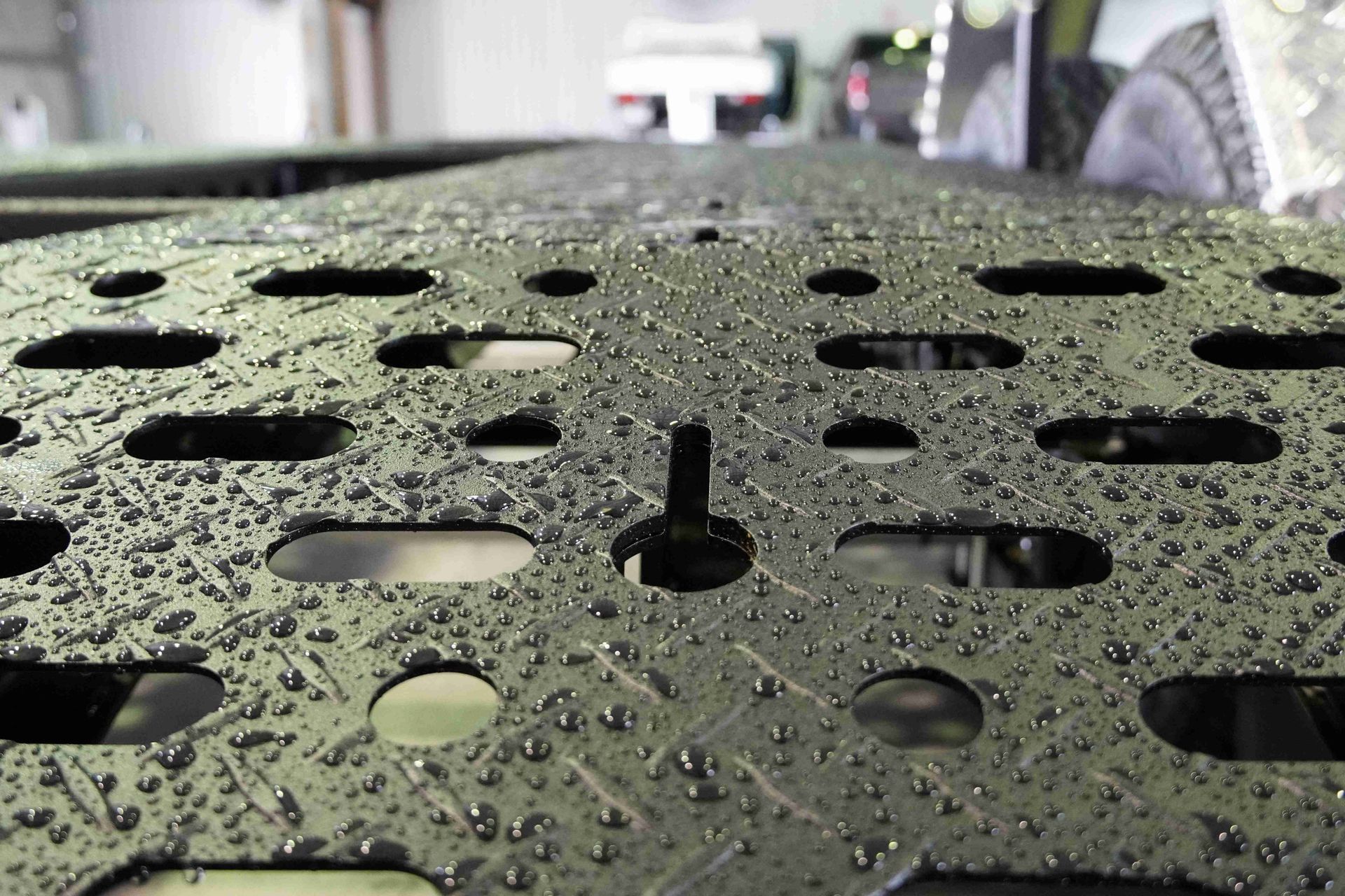 The 3mm steel decking plate of a pro series plant trailer.