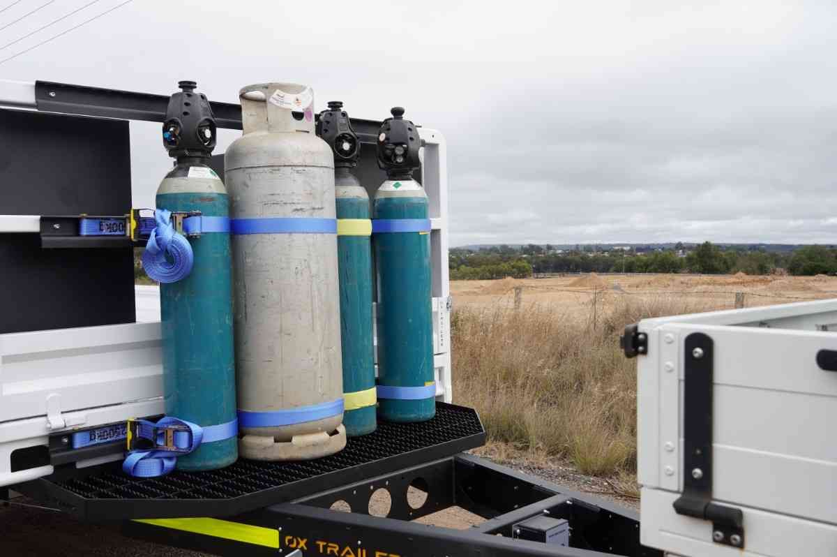 Gas cage mounted on the drawbar of a custom mine spec trailer for mobile boilermaker.