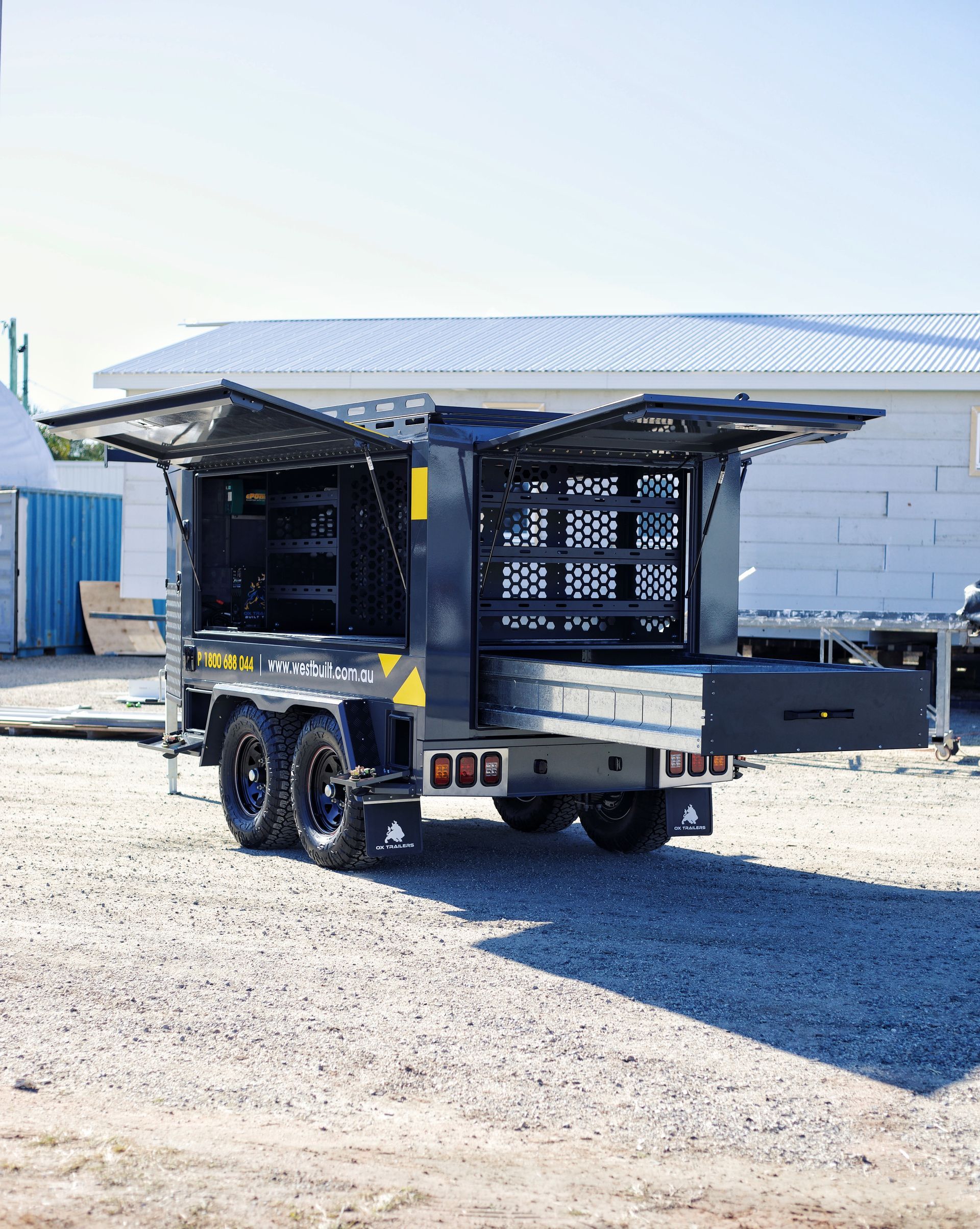 The builders trailer with all doors open, showing opening sizes.