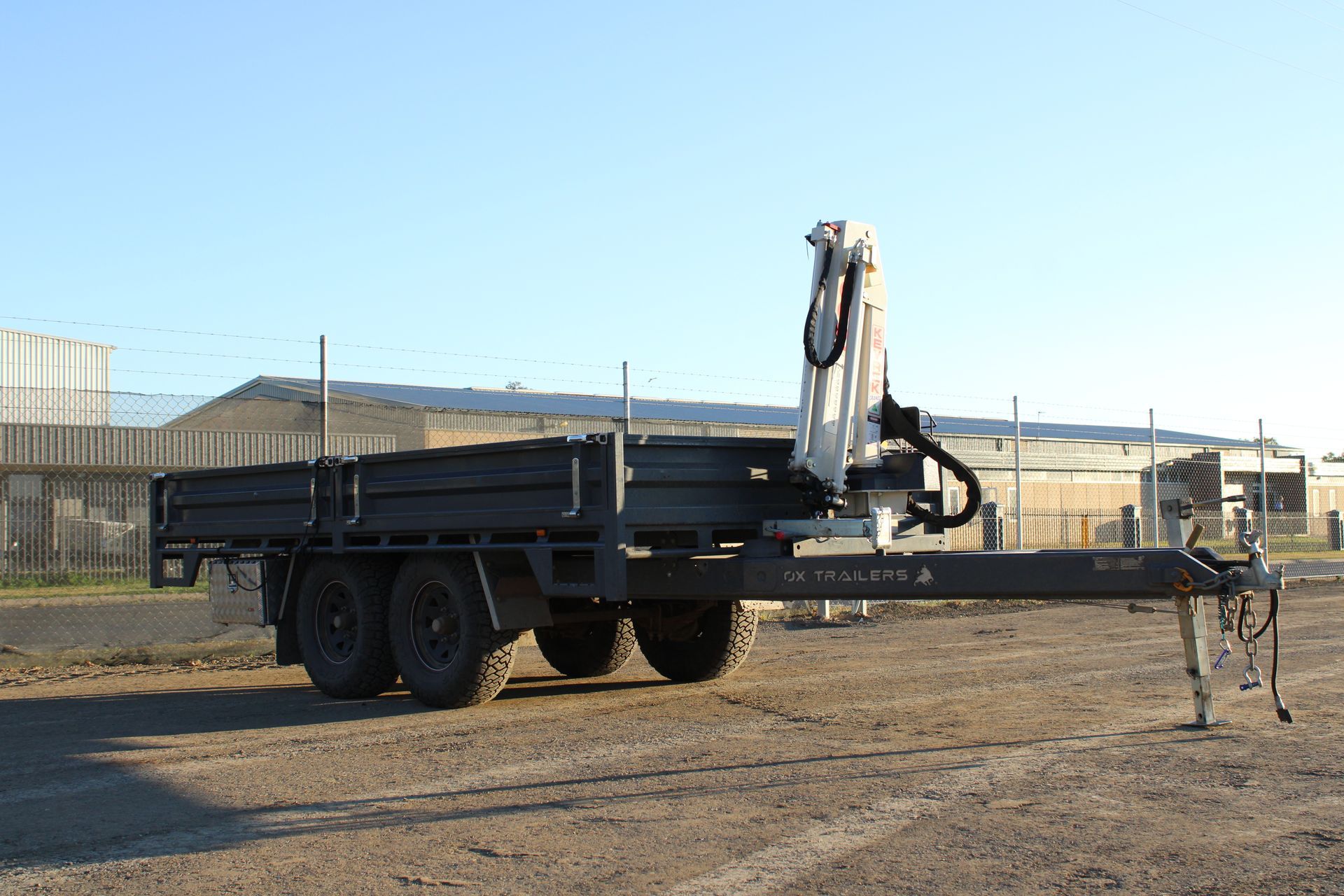 A flat top trailer on the construction site of WestBuilt Homes. 