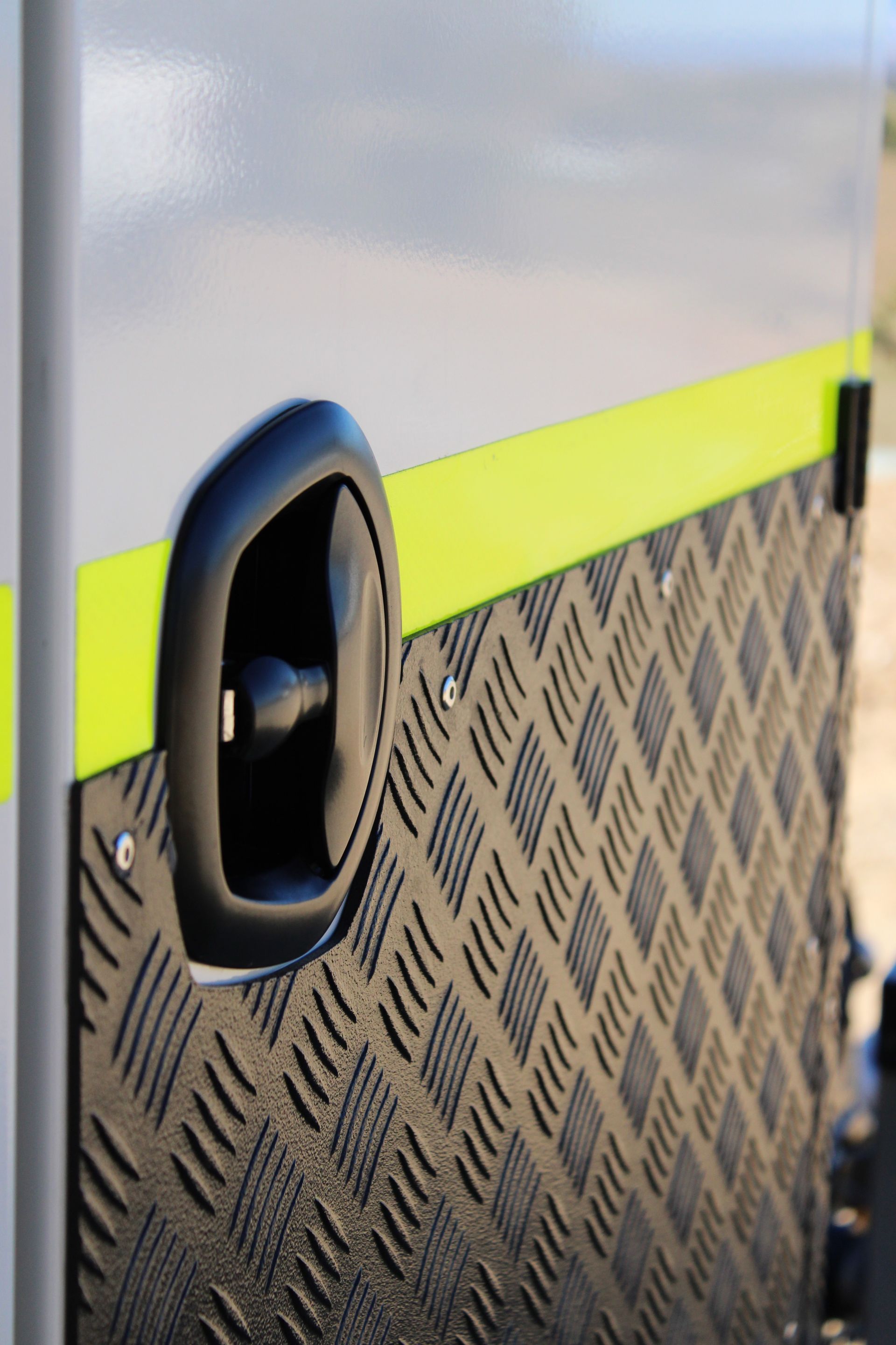 Relfective body tape on the front drawbar box of a service trailer
