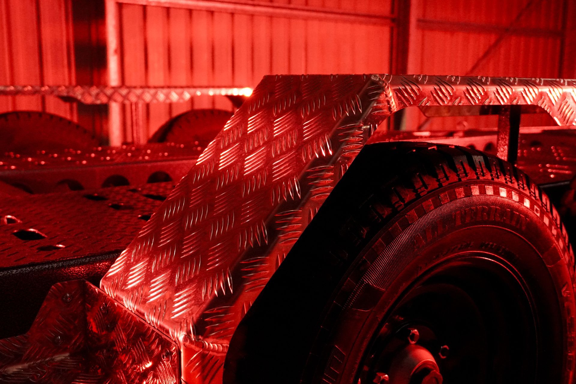 Checker plate mudguard for plant trailer. Built for endurance and scratch resistance.