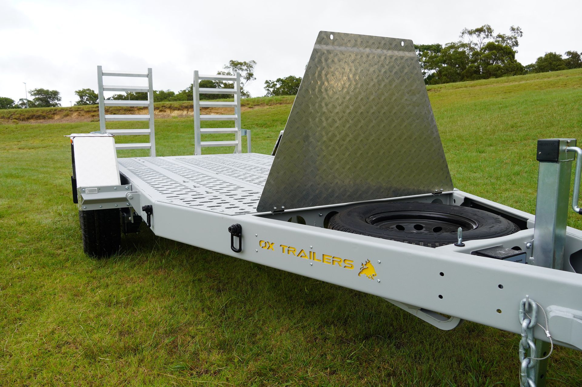 the Hinged Spare Tyre Cover of an ox plant trailer.