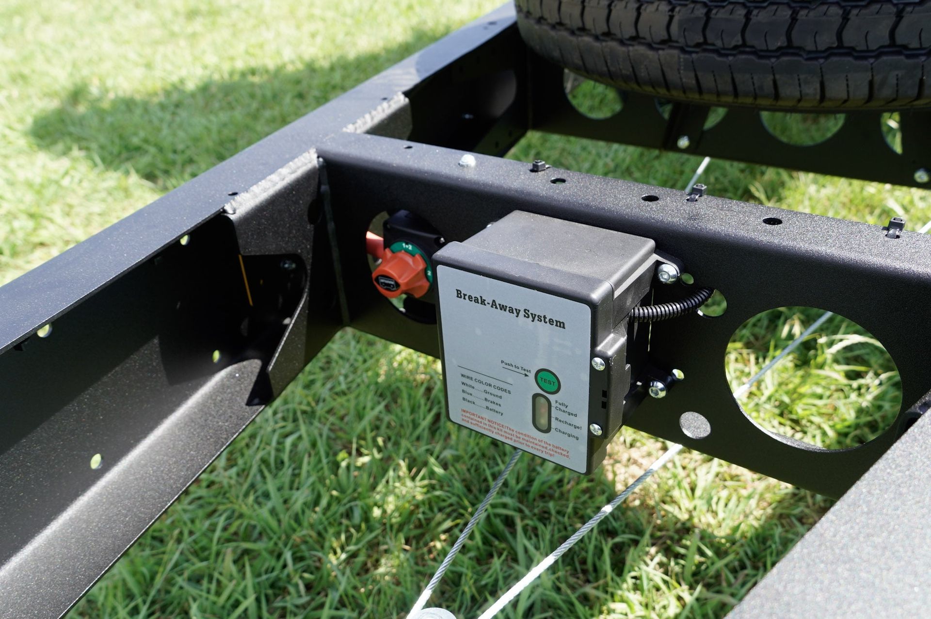 The break-away system of an ox trailer trade series flat top trailer.