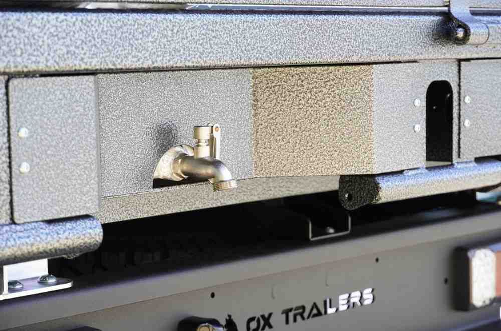 Two Aluminium Undertray water tanks installed on the rear of a flat top trailer.