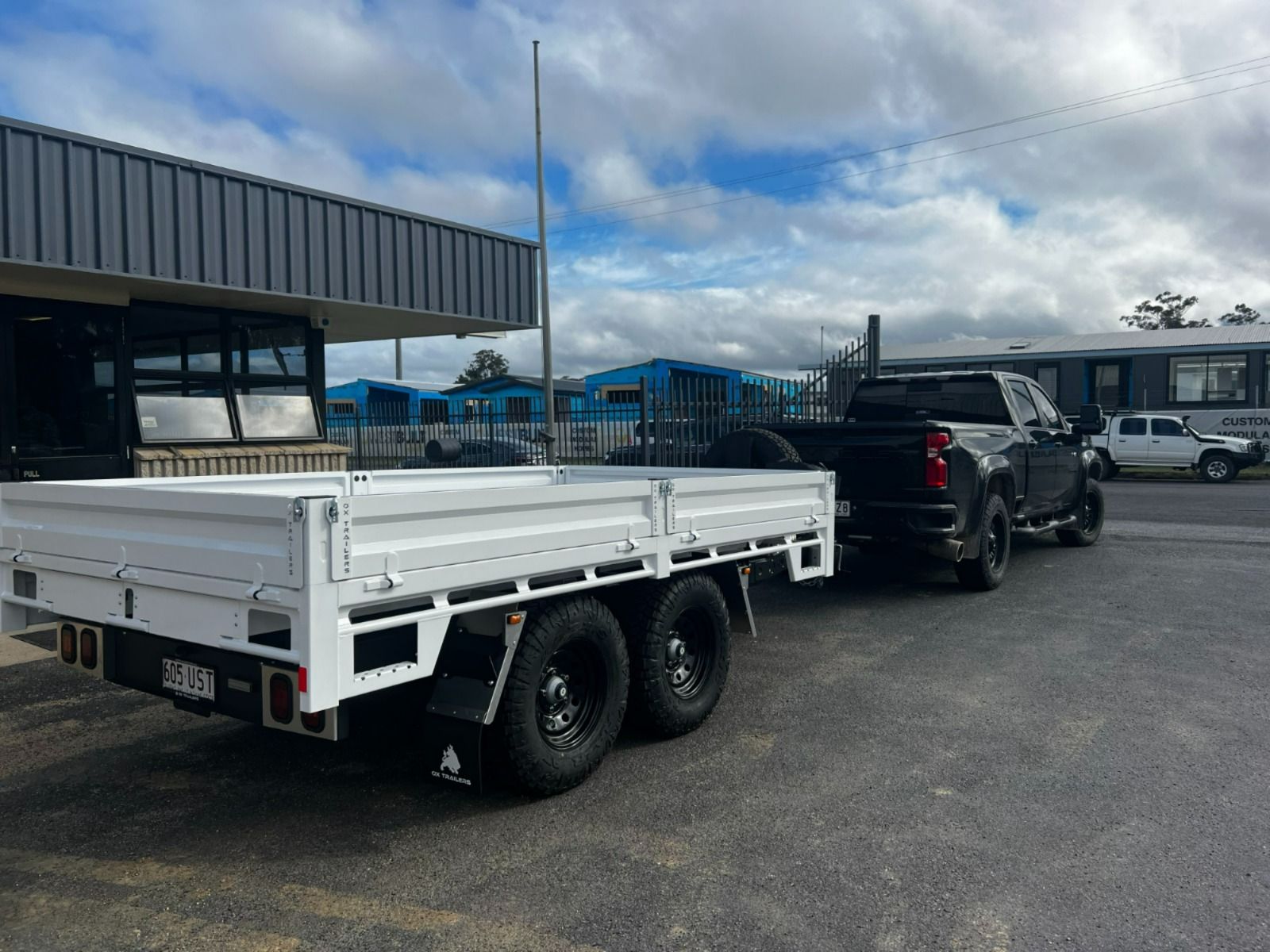 The monster hire pick-up towed behind a ram 2500 on pick-up day from the Ox Trailers HQ.