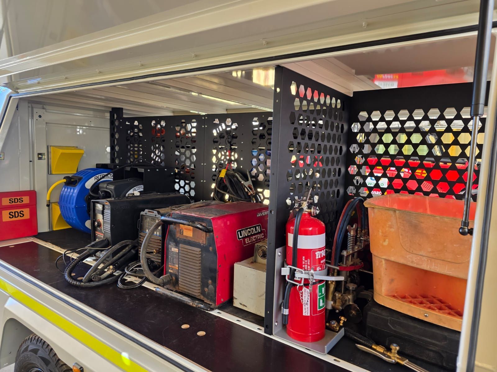 Secure fire extinguisher storage in custom service trailer for wasco energy by ox trailers.