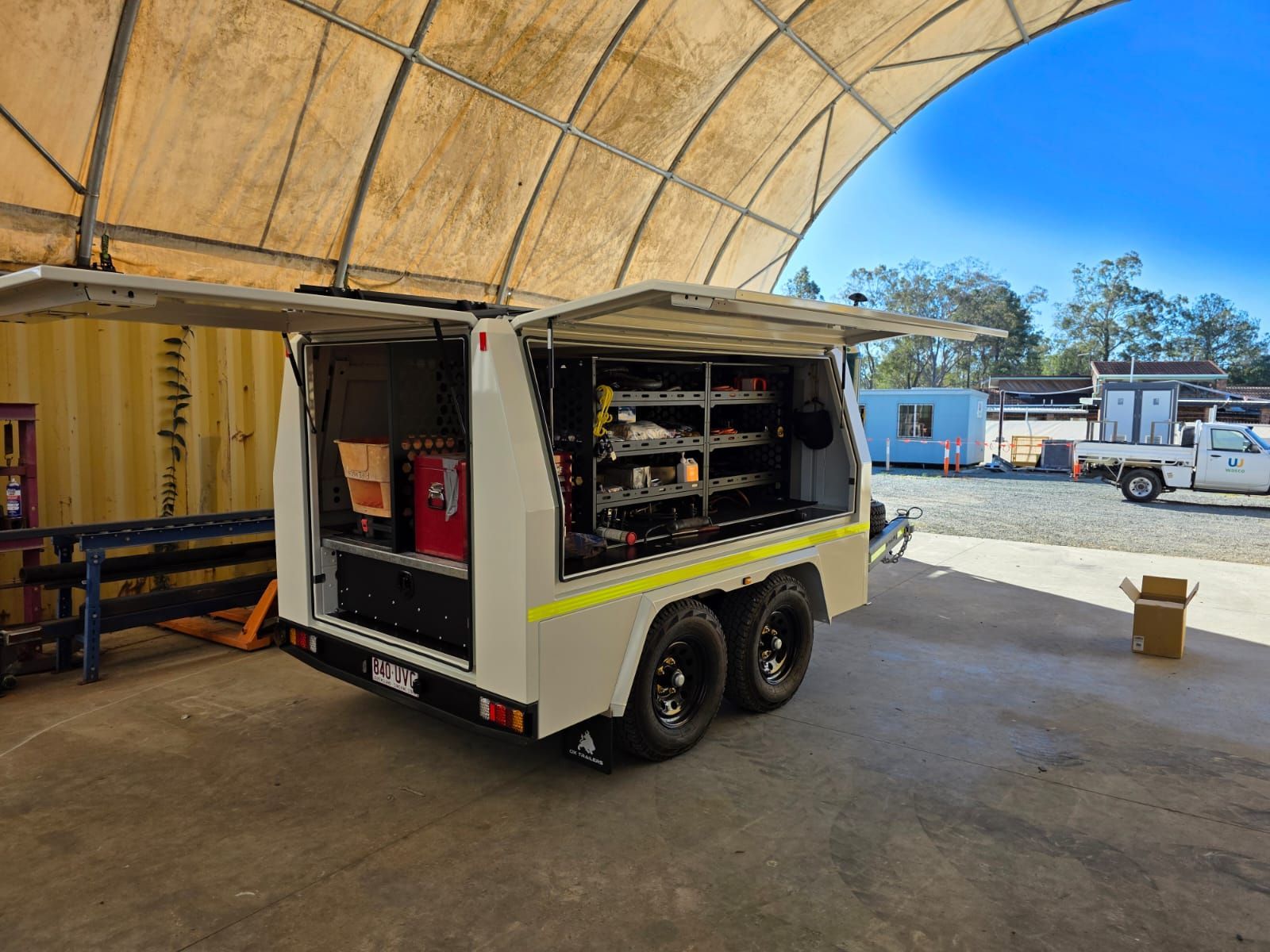 SDS station, wheel chocks, air reels fitted internally into custom service trailer for wasco energy by Ox Trailers,