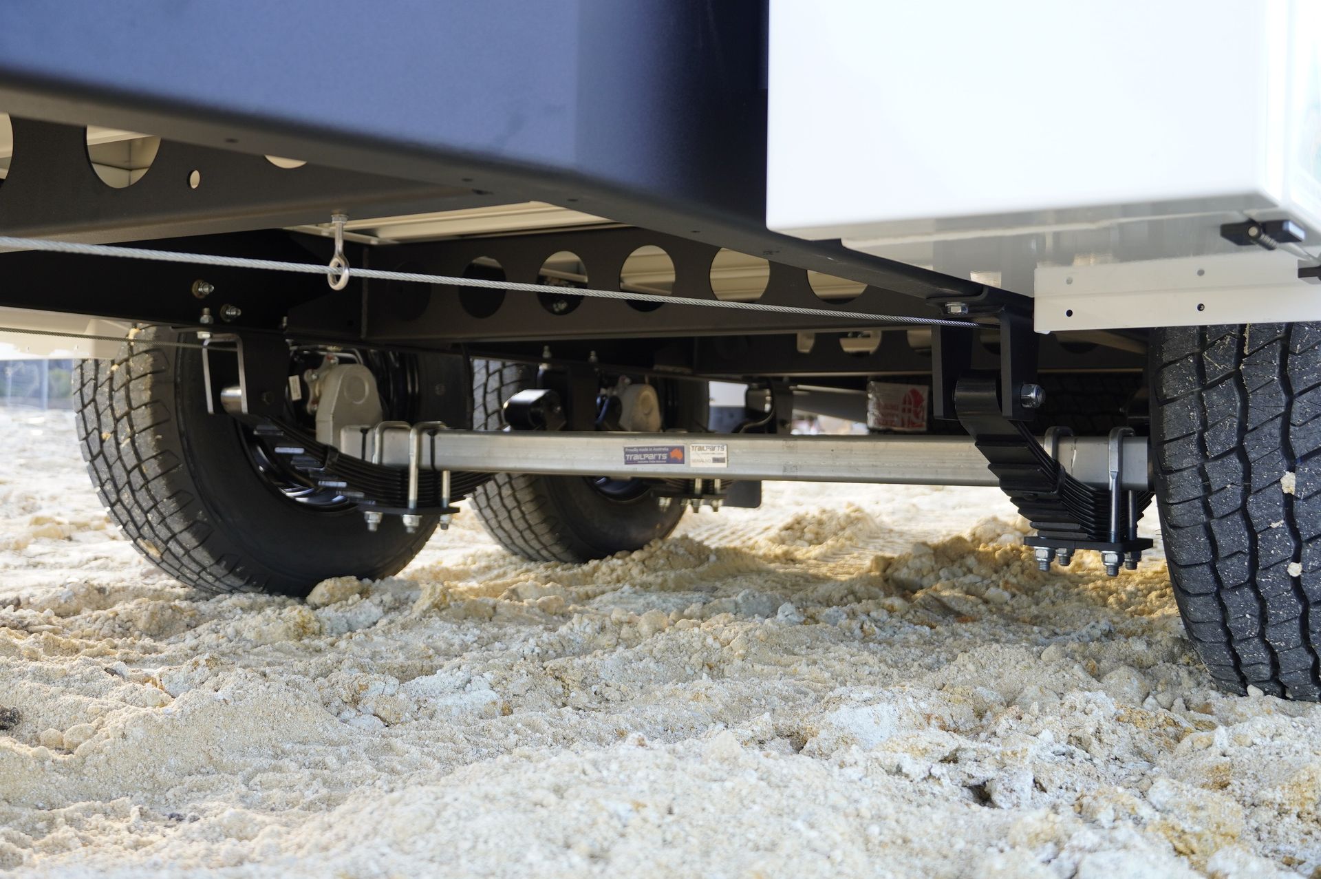 heavy duty ox trailers lad sharing leaf spring suspension, designed to be durable over rough terrain.