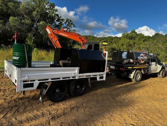 Harlock's Flat Top trailer leaving the site after repairing large machinery.