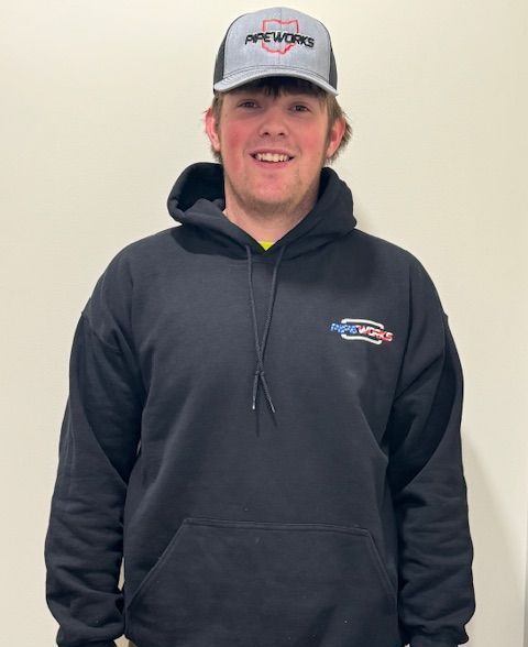 Man wearing a black hoodie and a hat with the