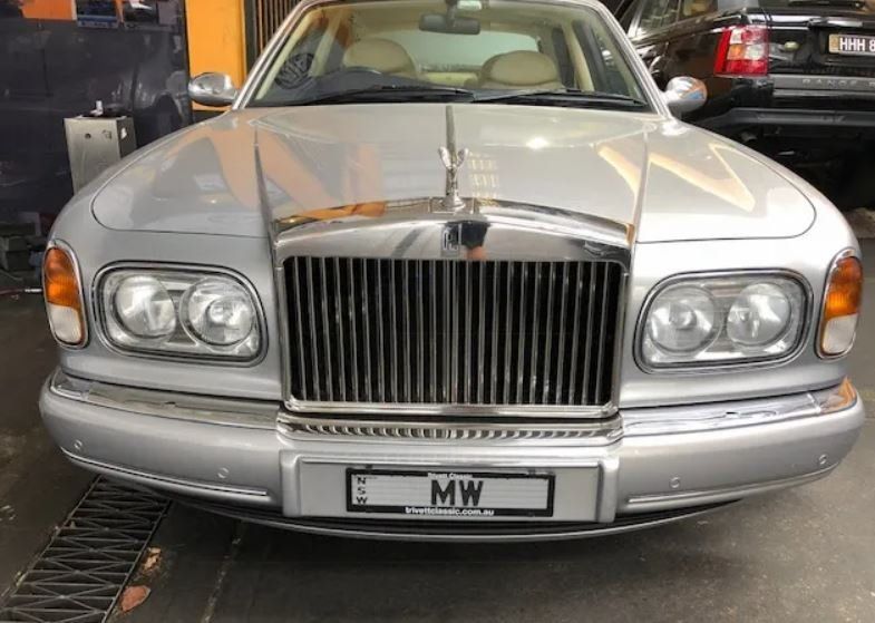 man checking the dent