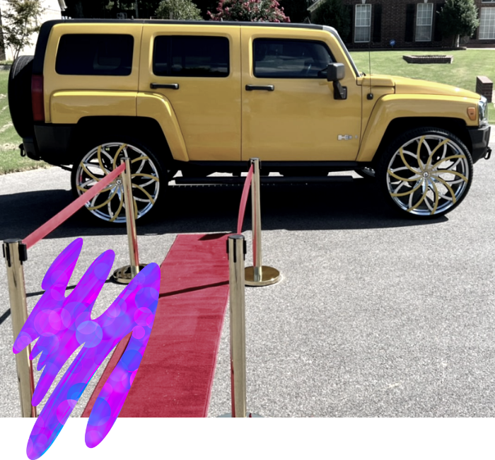 Yellow Hummer parked behind red carpet ropes at an outdoor event