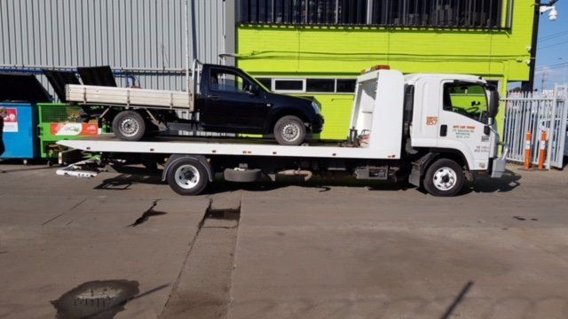 Company Tow Truck with a Black Car on the Top — Brooklyn, Vic — Autocare Towing Pty Ltd