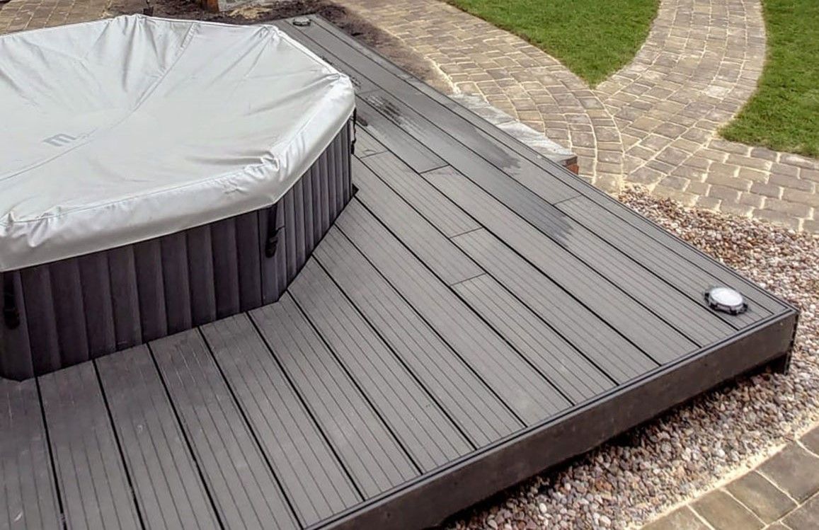 Zest Decking Matlock - brown composite decking fitted around a hot tub