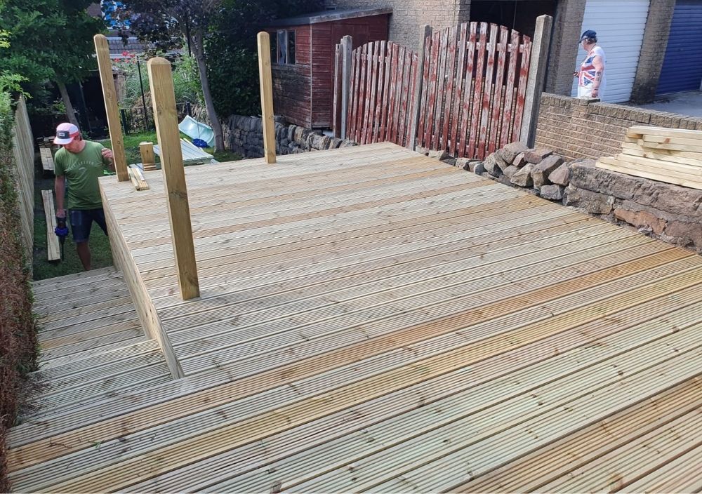 Zest Decking Matlock - brown composite decking fitted around a hot tub