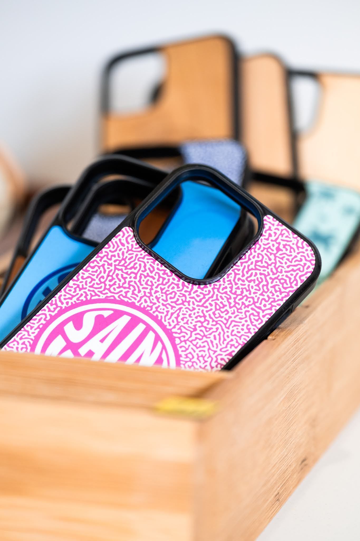 A display of wooden coasters and keychains on a table