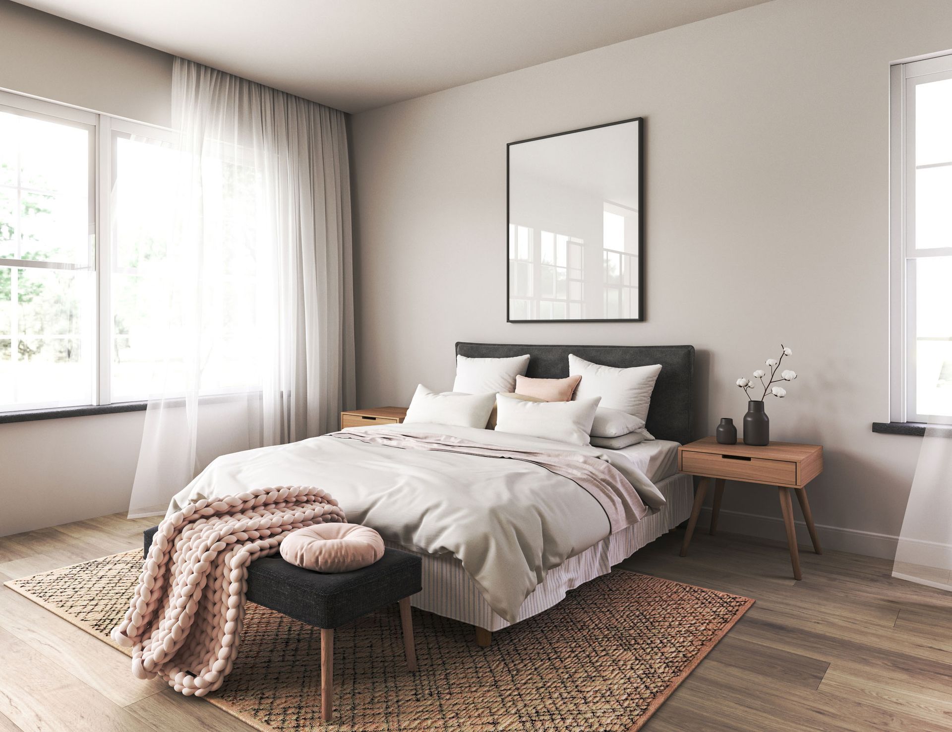 Cozy bedroom with bed, neutral tones, large windows, wood nightstands, framed art, and textured rug.