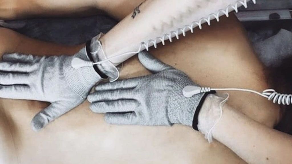 A woman is getting a Bioenergetic Meridians Massager massage Essence of Healing