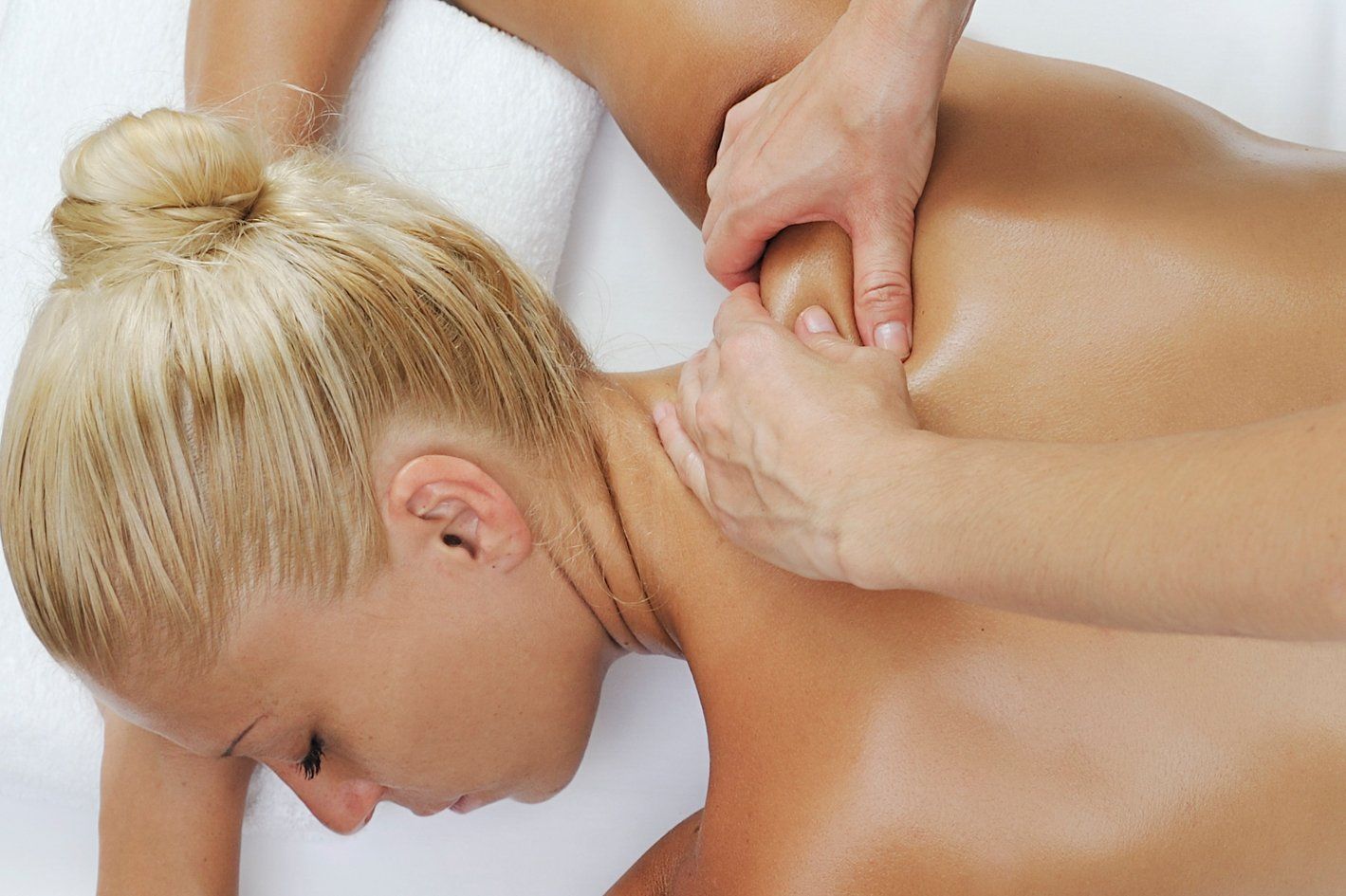 A woman is getting a massage on her back.