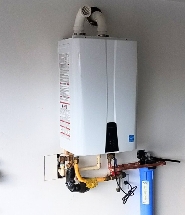 A white water heater is mounted to a white wall
