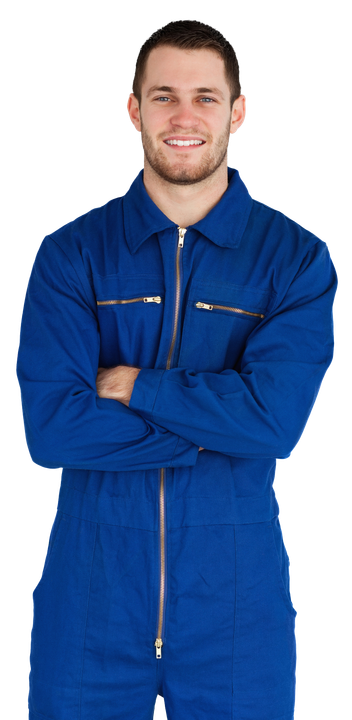 A man in a blue jumpsuit with his arms crossed