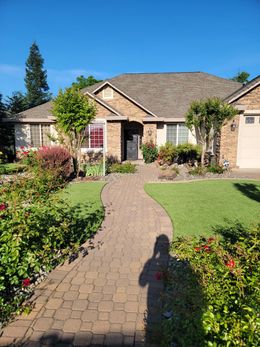 A house with a brick walkway leading to it