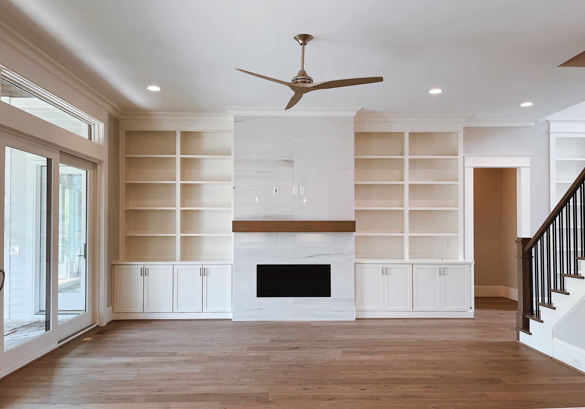 Custom built-in bookshelves and millwork in living area