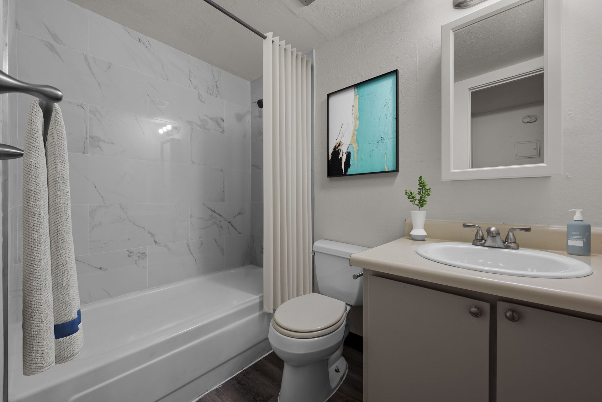 Photo showing a bathroom with a bathtub/shower combo