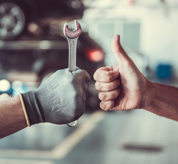Hands of The Repair Man And The Customer — Golden Valley, MN — Boulevard Automotive & Towing