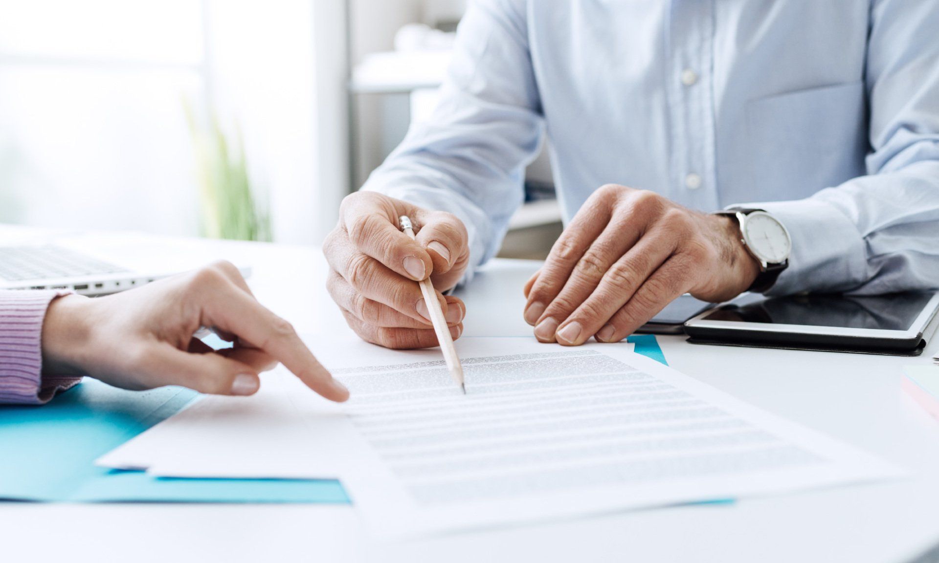 people looking over document line by line together