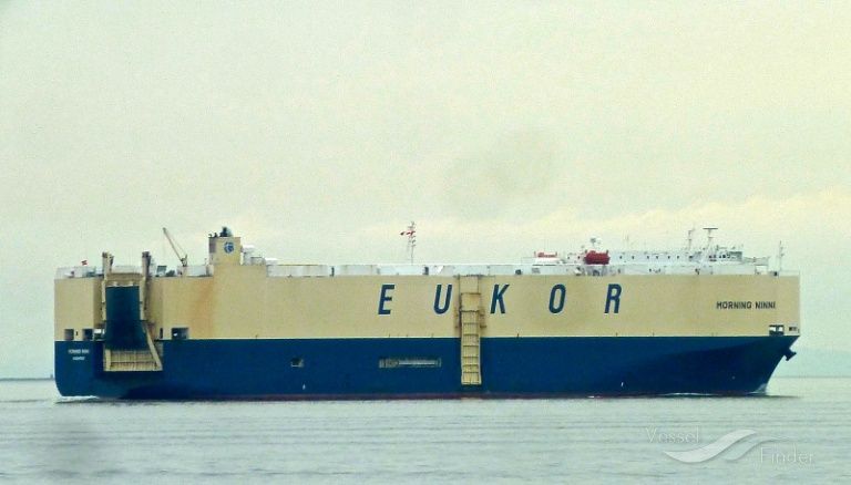 Large blue and beige car carrier ship