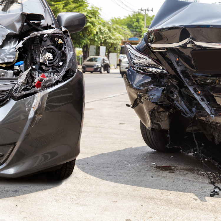 A car with a broken headlight is parked next to another car