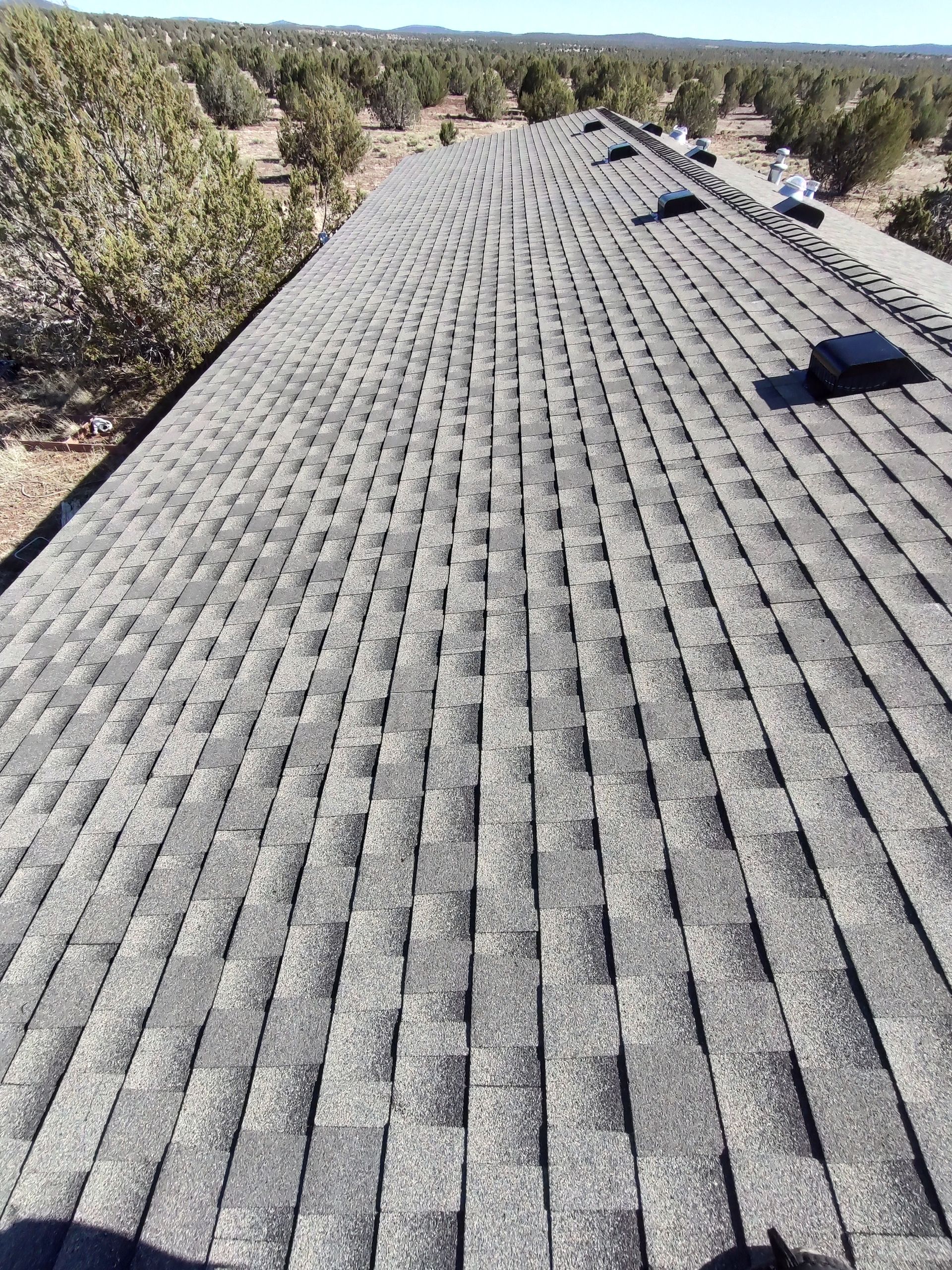 A large roof with a lot of shingles on it.