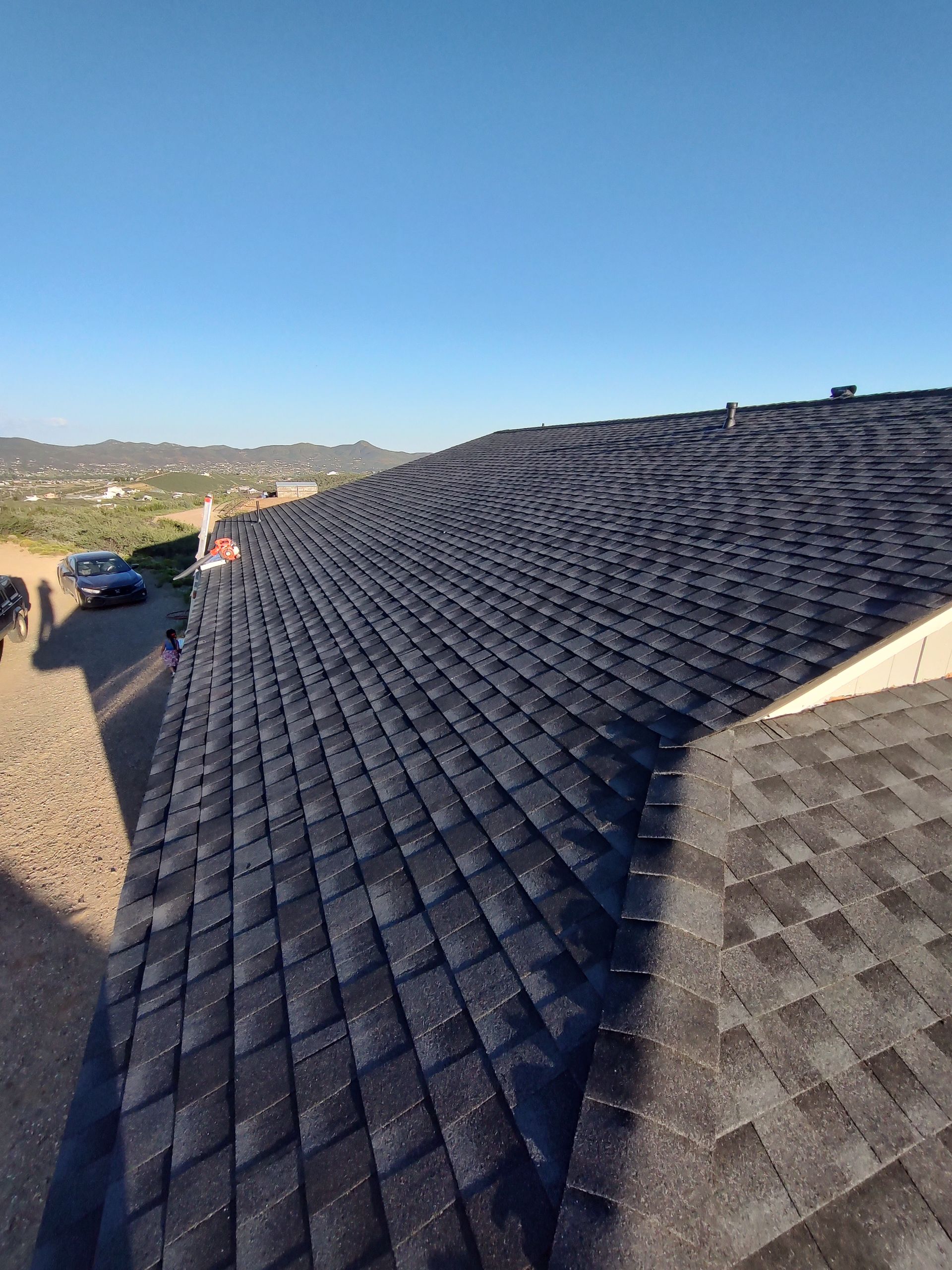 A large roof with a lot of shingles on it.