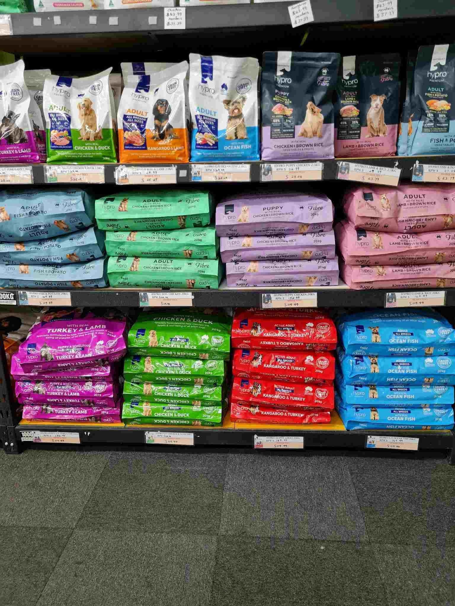 Shelf Filled With Bags of Dog Food in a Store — Rocky Pet World in Norman Gardens, QLD