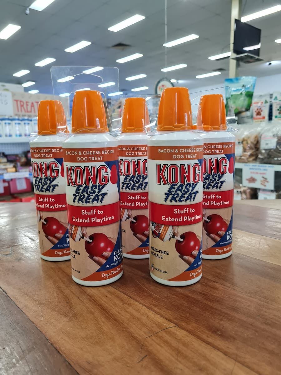 Bunch of Kong Treats Are Sitting on a Wooden Table — Rocky Pet World in Norman Gardens, QLD