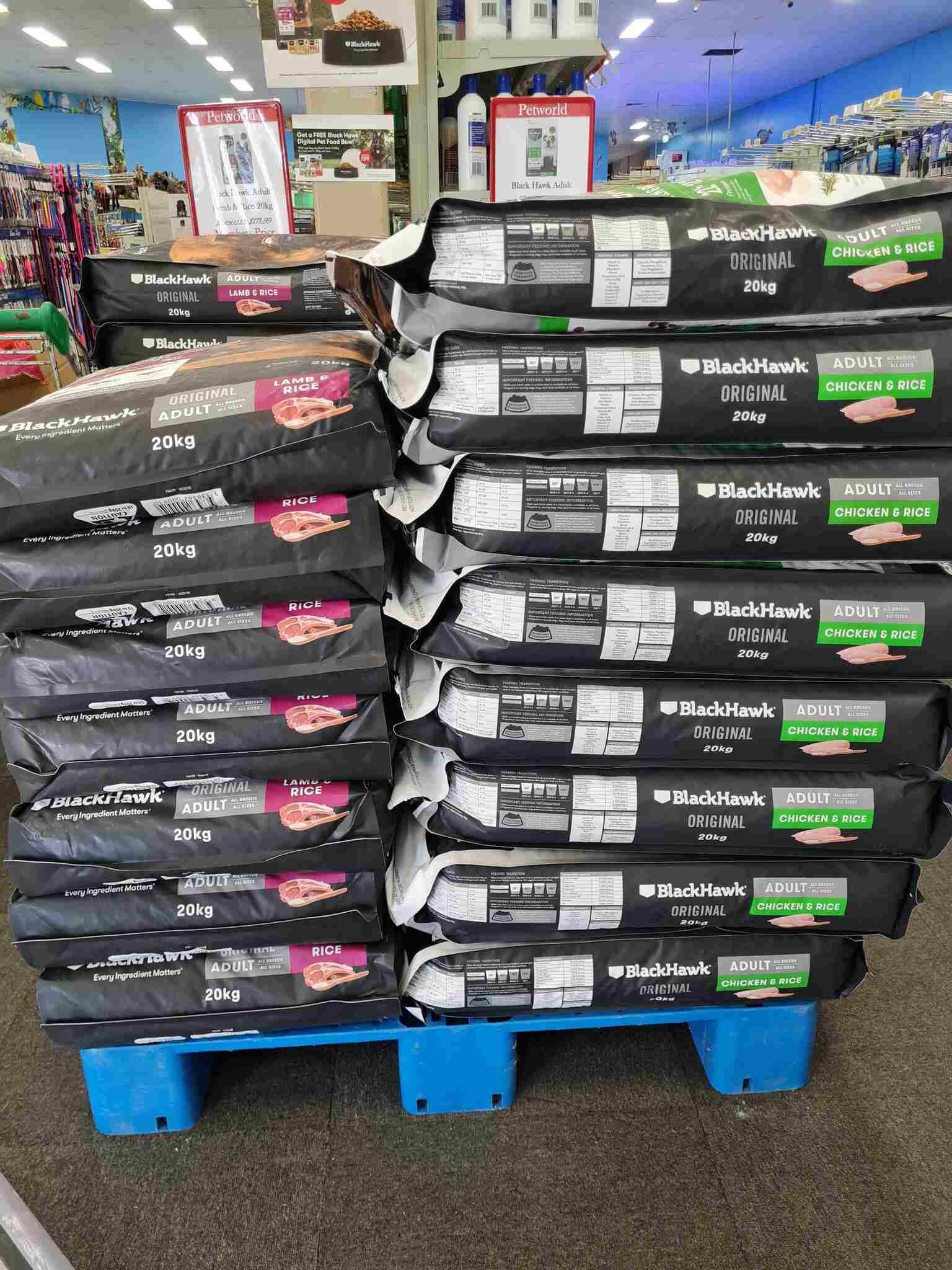 Pallet of Dog Food is Stacked on Top of Each Other in a Store — Rocky Pet World in Norman Gardens, QLD