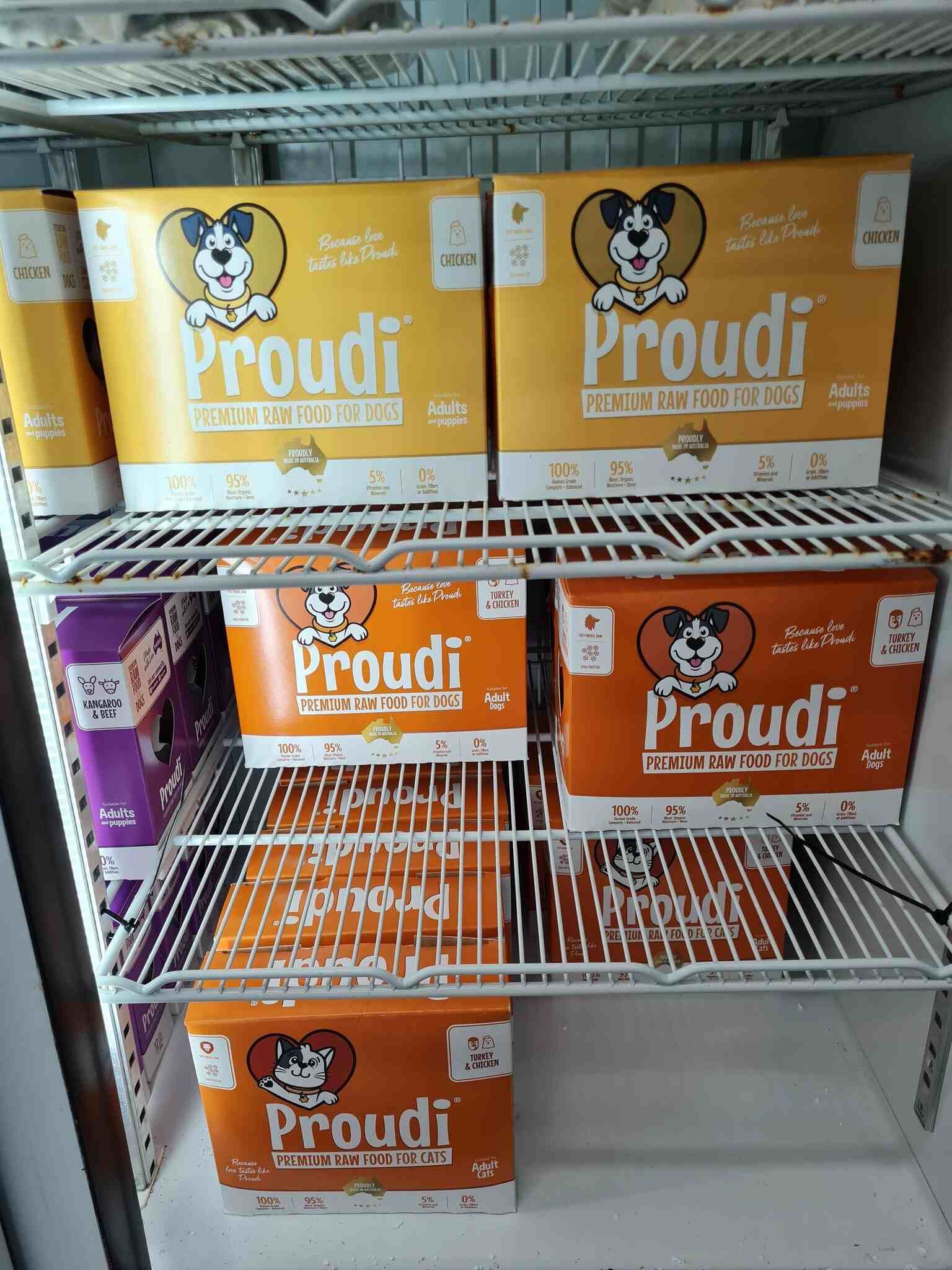 Refrigerator Filled With Boxes of Proudi Dog Food — Rocky Pet World in Norman Gardens, QLD