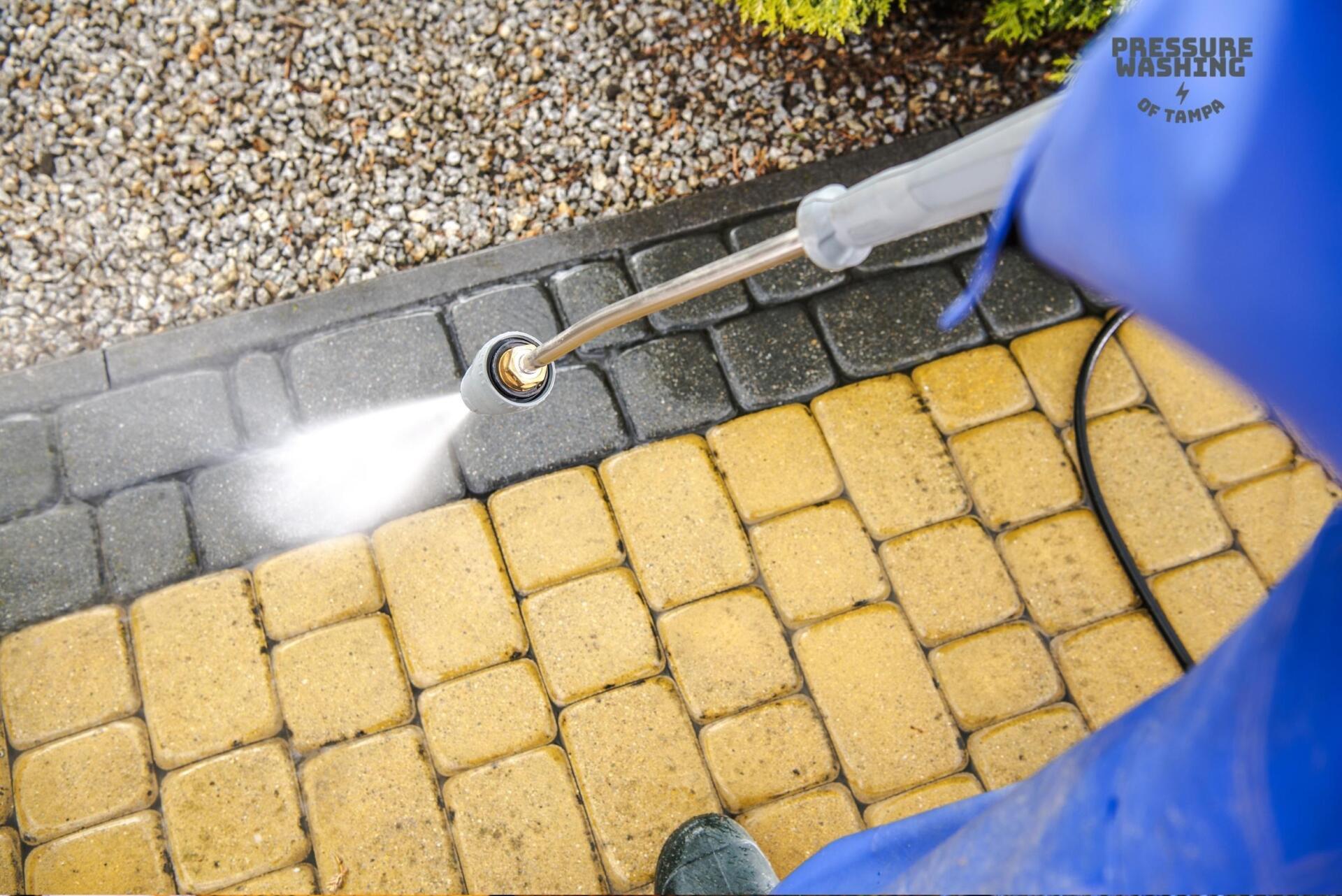 A professional in Tampa performing expert pressure washing for a residential property