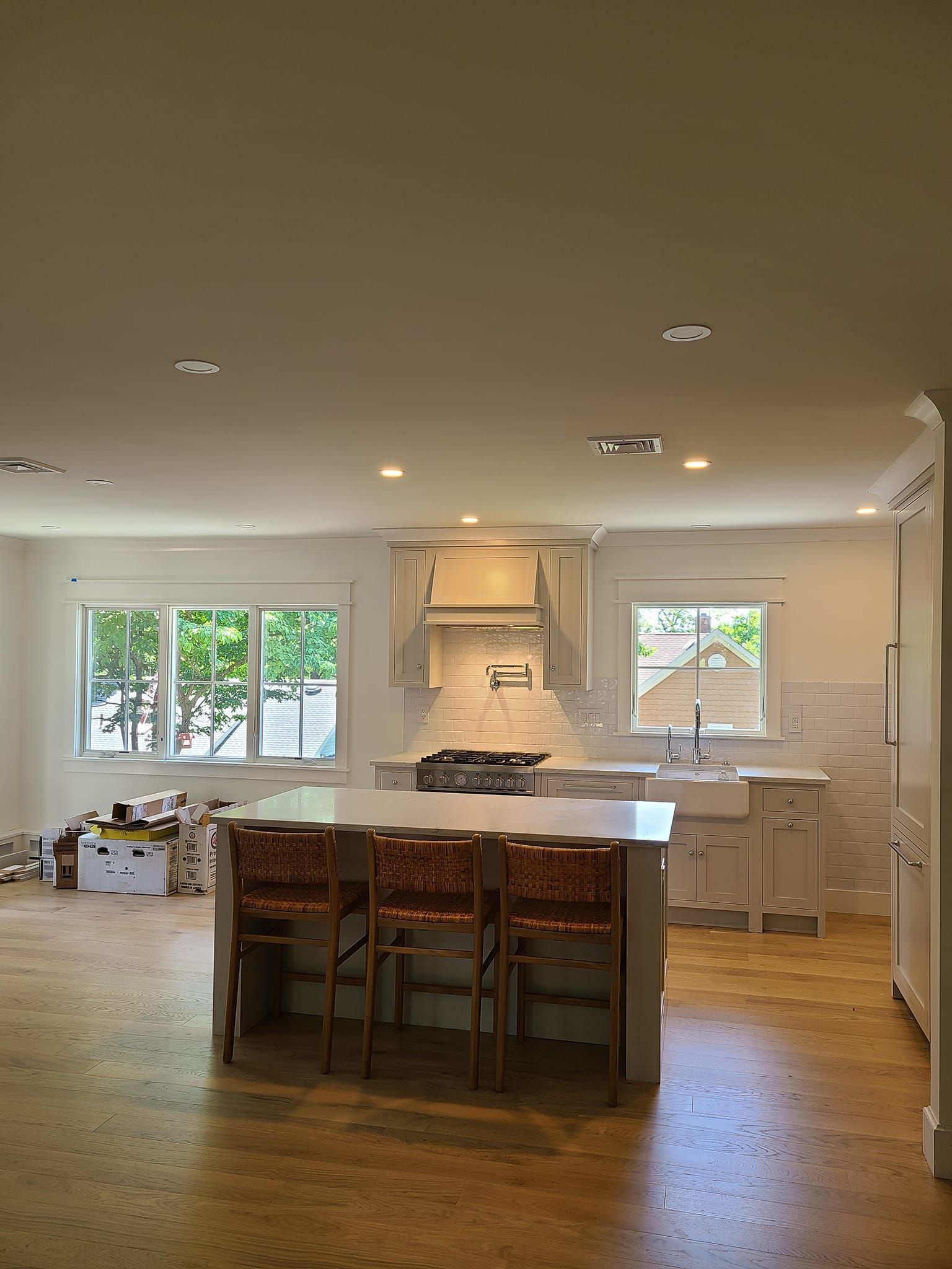 A kitchen with a large island in the middle of it
