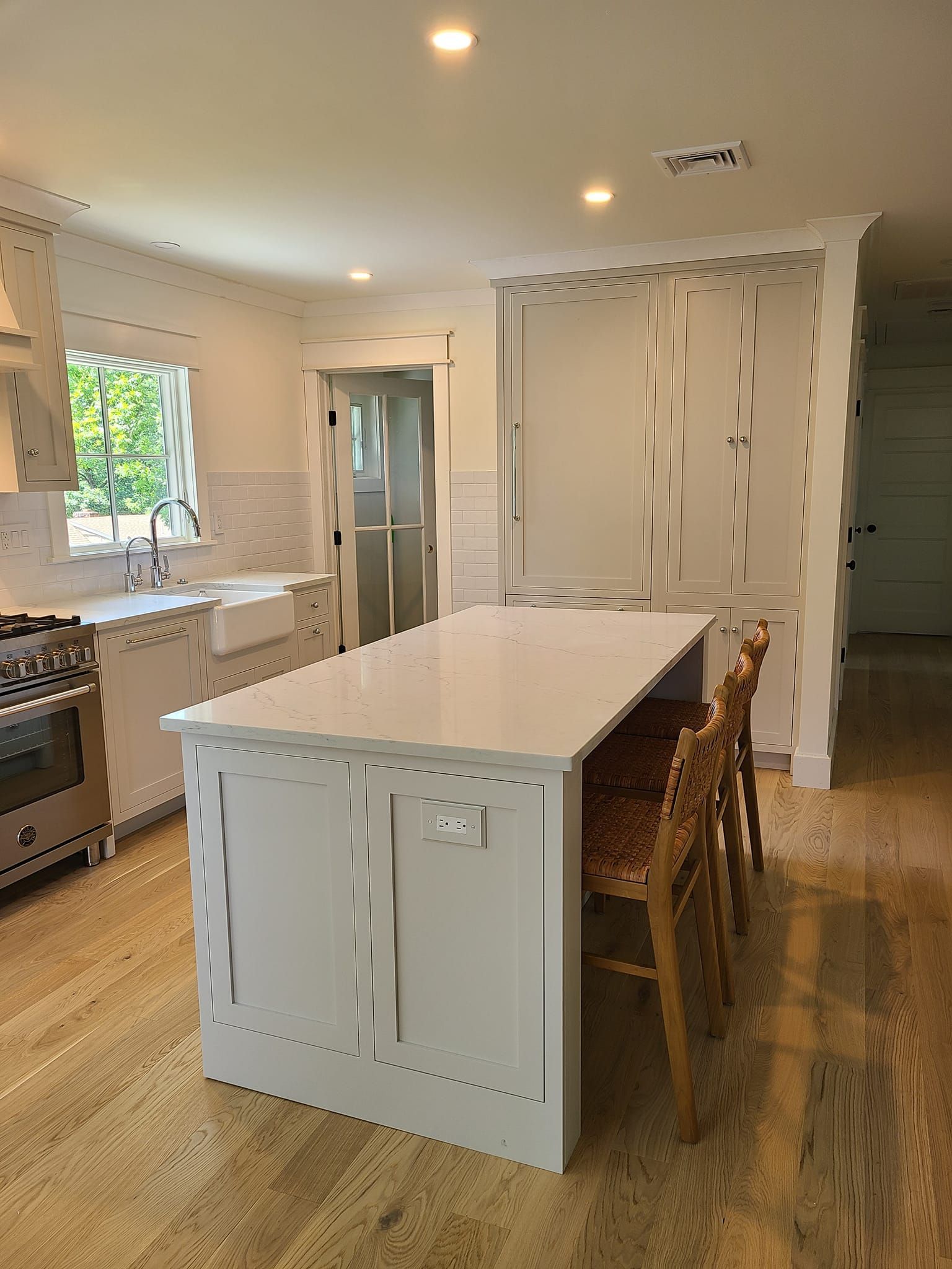 There is a large island in the middle of the kitchen.